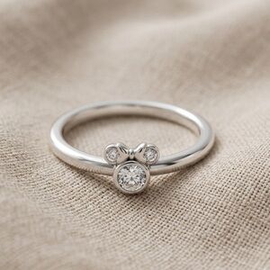 Delicate Silver Bow Accent Ring with Sparkling Stones - Women's Jewelry